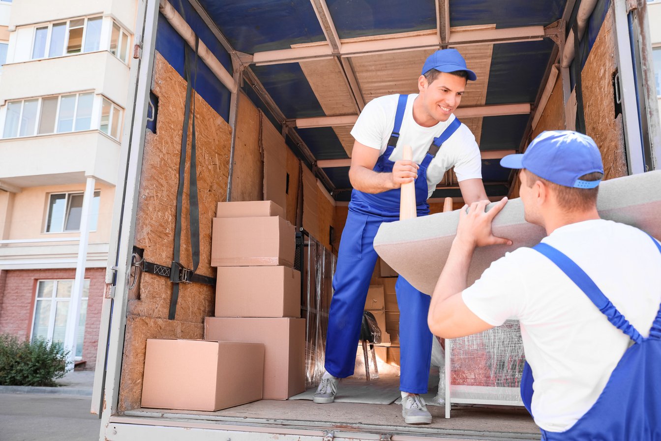 Loaders Taking Furniture from Truck